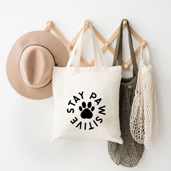 
            
                Load image into Gallery viewer, Stay Pawsitive Paw Tote
            
        